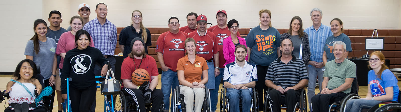 Group photo at a disability awareness activity in the gym