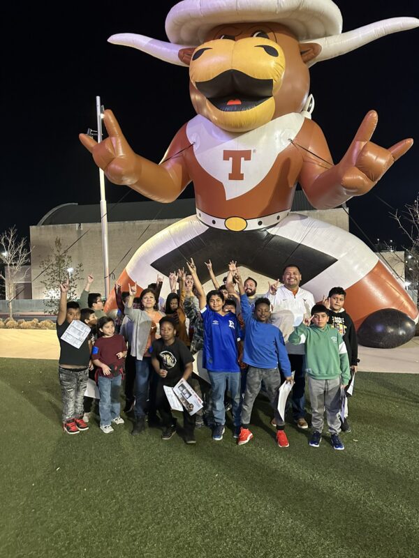 NLP Students with Giant Hook 'Em at the Moody Center