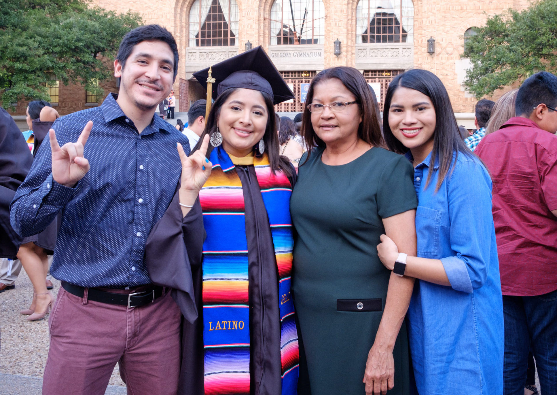 Latina graduate with her family at Latinx Graduation